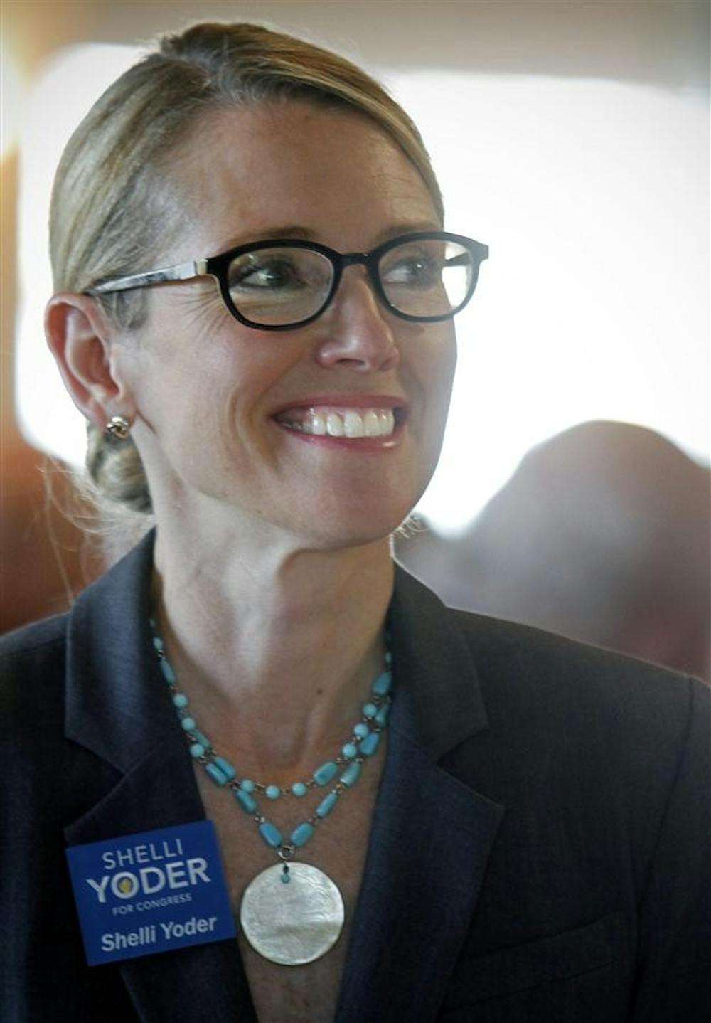 Shelli Yoder listens to an opening speech by Margaret McGovern, the former mayor of Greenwood, during a Johnson County Democrats dinner on Thursday at the Valle Vista Golf Club in Greenwood.