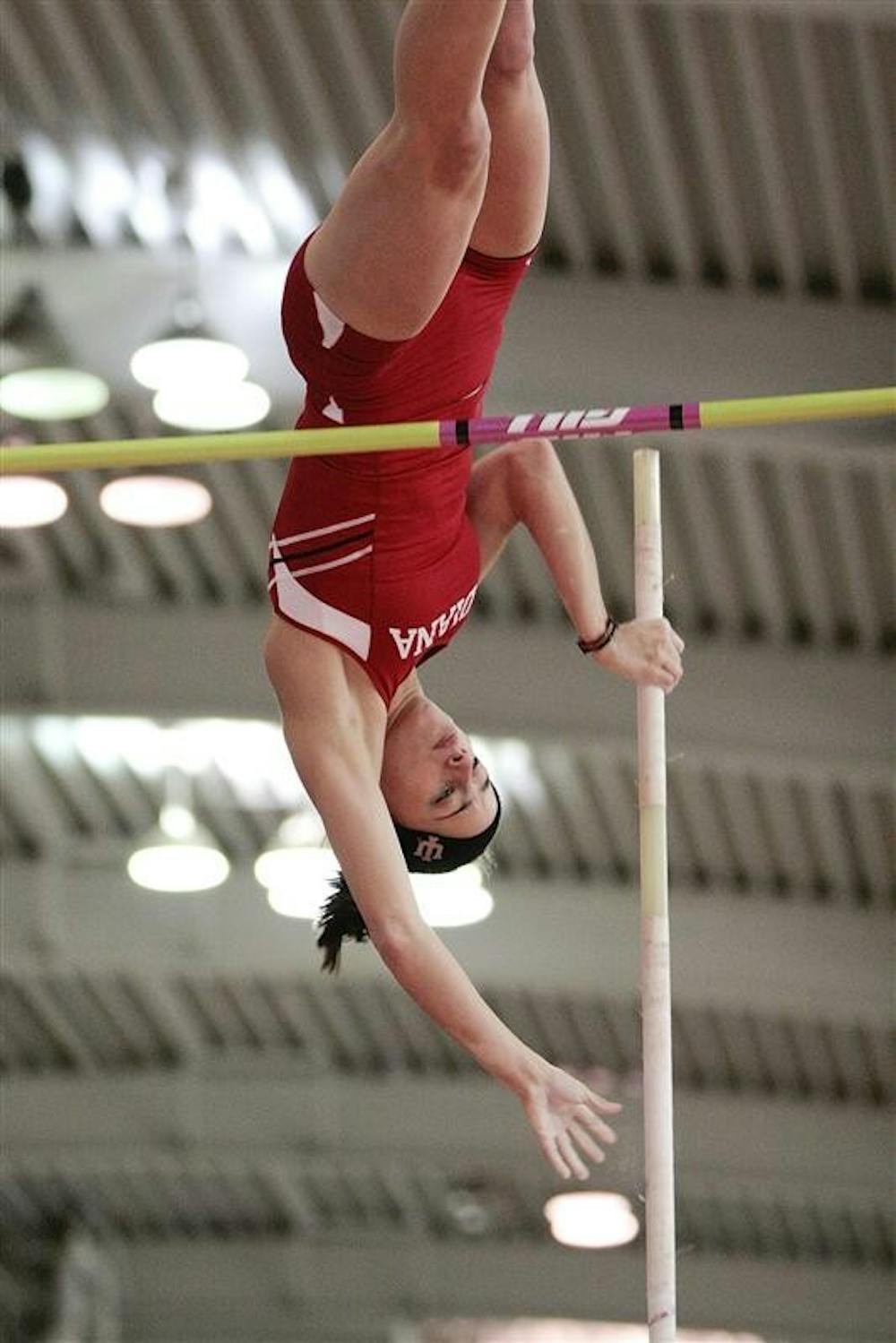 Junior pole vaulter Vera Neuenswander attempts an attempt during the Indiana Invitational Jan. 17 at Gladstein Fieldhouse. Neuenswander won the event with a height of 13 feet, 5.25 inches.