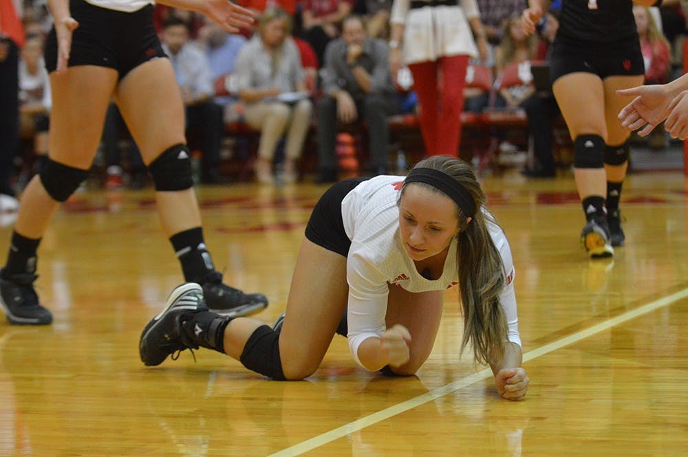 Senior defensive specialist Kyndall Merritt pounds her fist on the floor after missing a ball during the match against Purdue Wednesday evening at University Gym. The Hoosier lost to the Boilermakers 3 matches to 0.