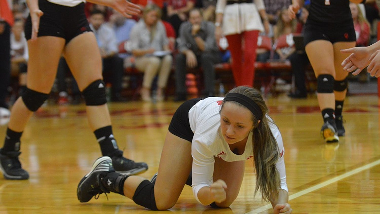 Senior defensive specialist Kyndall Merritt pounds her fist on the floor after missing a ball during the match against Purdue Wednesday evening at University Gym. The Hoosier lost to the Boilermakers 3 matches to 0.