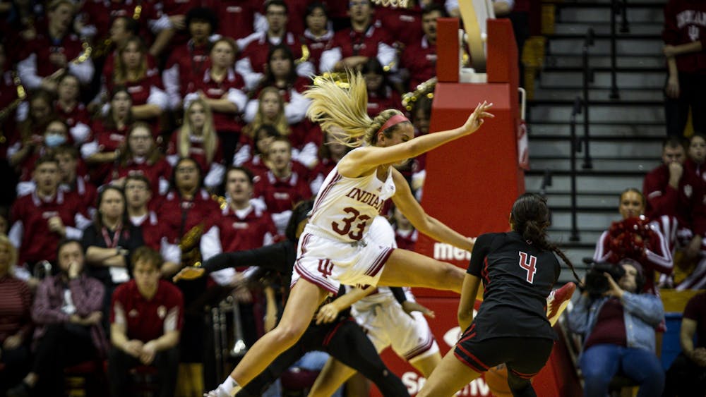 Junior Sydney Parrish goes for a block against Rutgers Jan. 29, 2023, at Simon Skjodt Assembly Hall in Bloomington. The Hoosiers beat Minnesota 77-54.