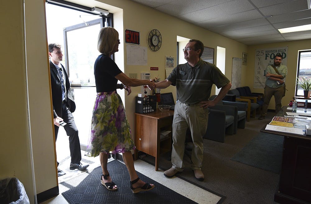 Staff from the Hoosier Hills Food Bank welcome Suzanne Crouch, Lieutenant Governor of Indiana. Crouch toured the warehouse on Friday.