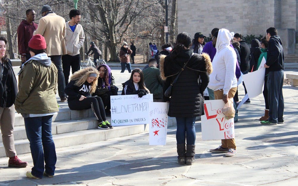 Demonstrators&nbsp;protest President Trump's recent executive orders at Showalter Fountain and&nbsp;carry signs like, "My faith teaches love for all, your policies don't-an American Muslim."