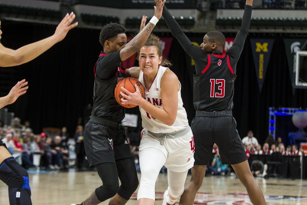 <p>Sophomore forward Aleksa Gulbe fights through the Rutgers defense March 6 in the quarterfinal round of the Big Ten Tournament at Bankers Life Fieldhouse in Indianapolis. Gulbe scored 15 points in the 78-60 victory over the Scarlet Knights.</p>