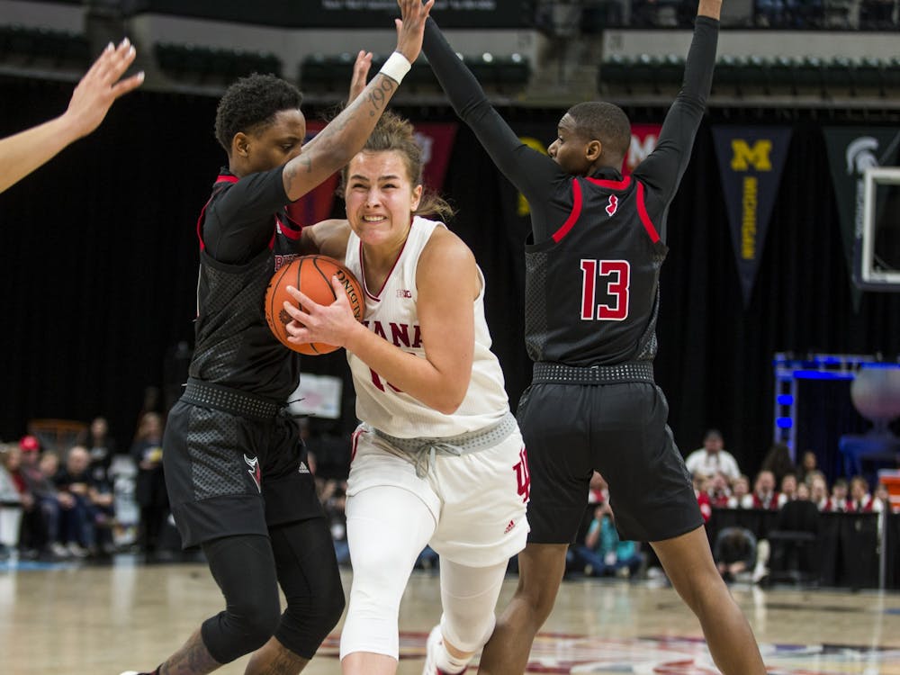 Sophomore forward Aleksa Gulbe fights through the Rutgers defense March 6 in the quarterfinal round of the Big Ten Tournament at Bankers Life Fieldhouse in Indianapolis. Gulbe scored 15 points in the 78-60 victory over the Scarlet Knights.