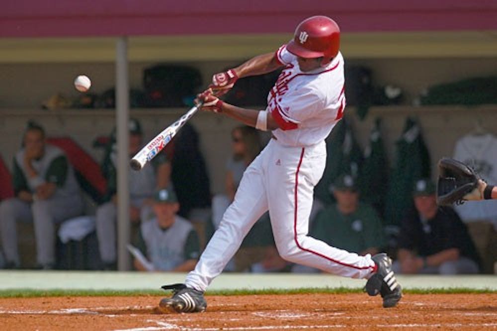 Hoosier freshman Sterling Mack puts the ball in play during the IU home victory over Michigan State 2-1 to open up Big Ten play Friday.