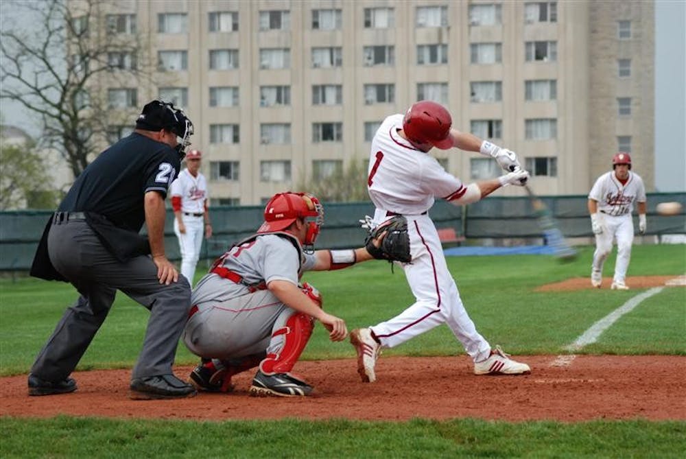 Infielder Tyler Rogers tries to bring home runners at second and third, including catcher Josh Phegley, with two outs in the ninth inning against Miami (Ohio) on Tuesday afternoon at Sembower Field. Though they lost 9-6 on Tuesday, the Hoosiers bounced back and beat Western Illinois 17-2 on Wednesday.