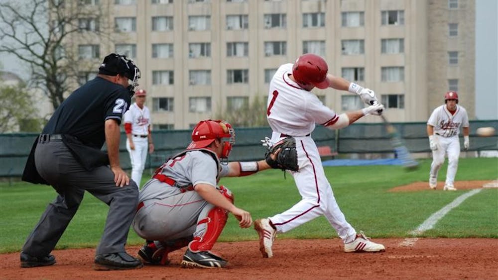 Infielder Tyler Rogers tries to bring home runners at second and third, including catcher Josh Phegley, with two outs in the ninth inning against Miami (Ohio) on Tuesday afternoon at Sembower Field. Though they lost 9-6 on Tuesday, the Hoosiers bounced back and beat Western Illinois 17-2 on Wednesday.