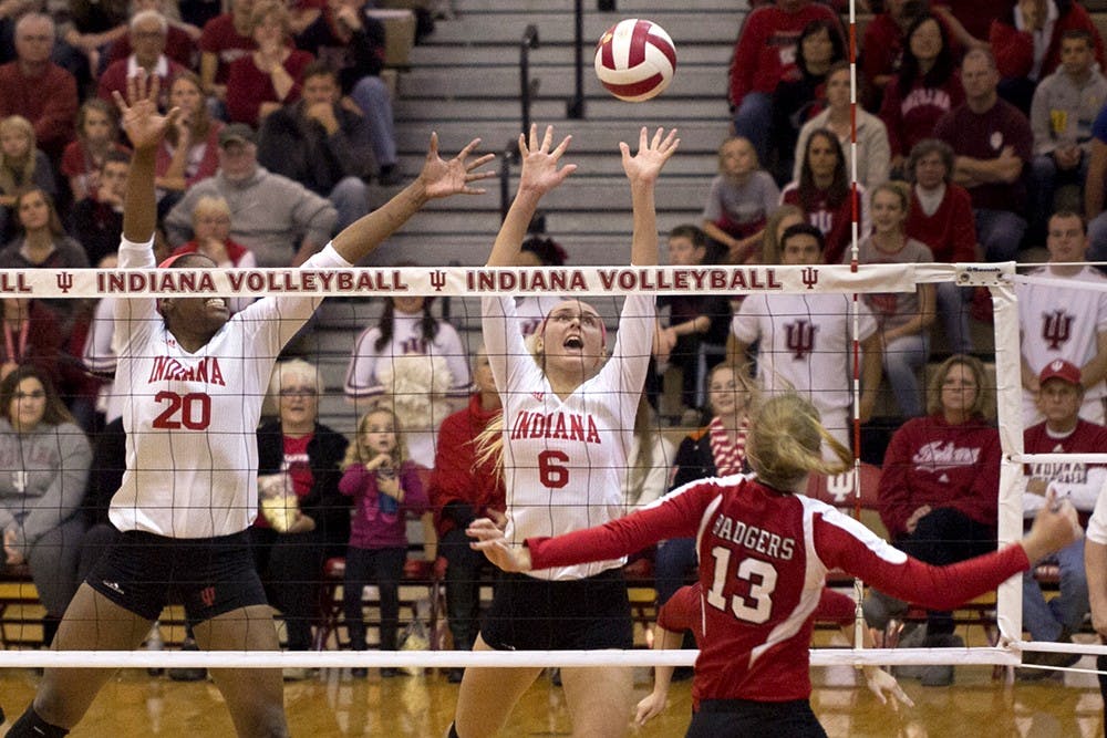 Sophomore Taylor Lebo goes up to block a spike during IU's match against Wisconsin on Saturday at University Gym. The Hoosiers lost 3-0 to the Badgers.