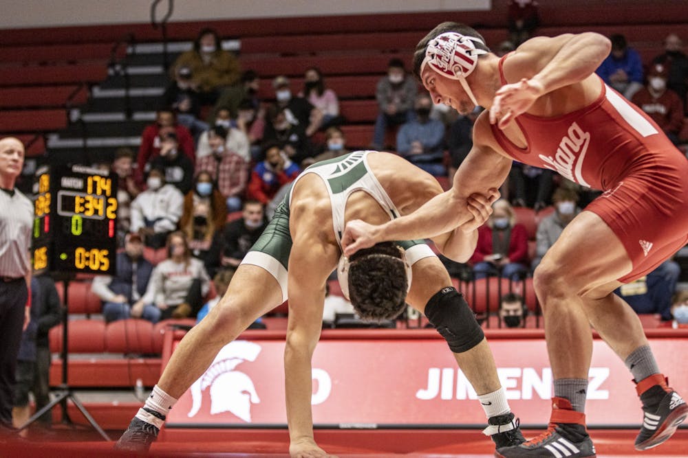 <p>Indiana redshirt sophomore Nick South grapples with Michigan State redshirt junior Nathan Jimenez on Jan. 17, 2022, at Wilkinson Hall. Indiana lost to Michigan State 17-15.</p>
