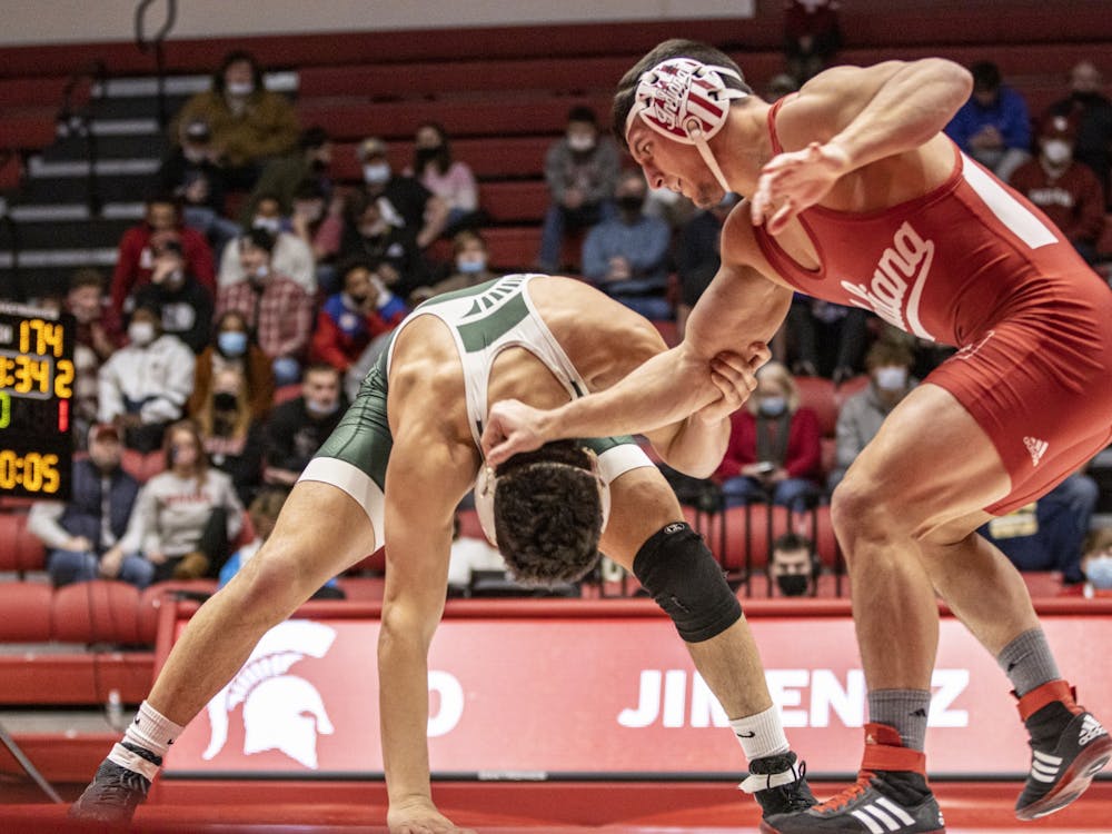 Indiana redshirt sophomore Nick South grapples with Michigan State redshirt junior Nathan Jimenez on Jan. 17, 2022, at Wilkinson Hall. Indiana lost to Michigan State 17-15.