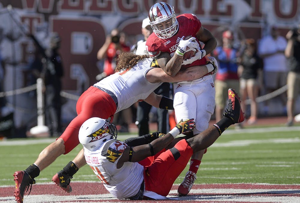 Senior running back D'Angelo Roberts gets tackled during IU's game against Maryland on Saturday at Memorial Stadium.