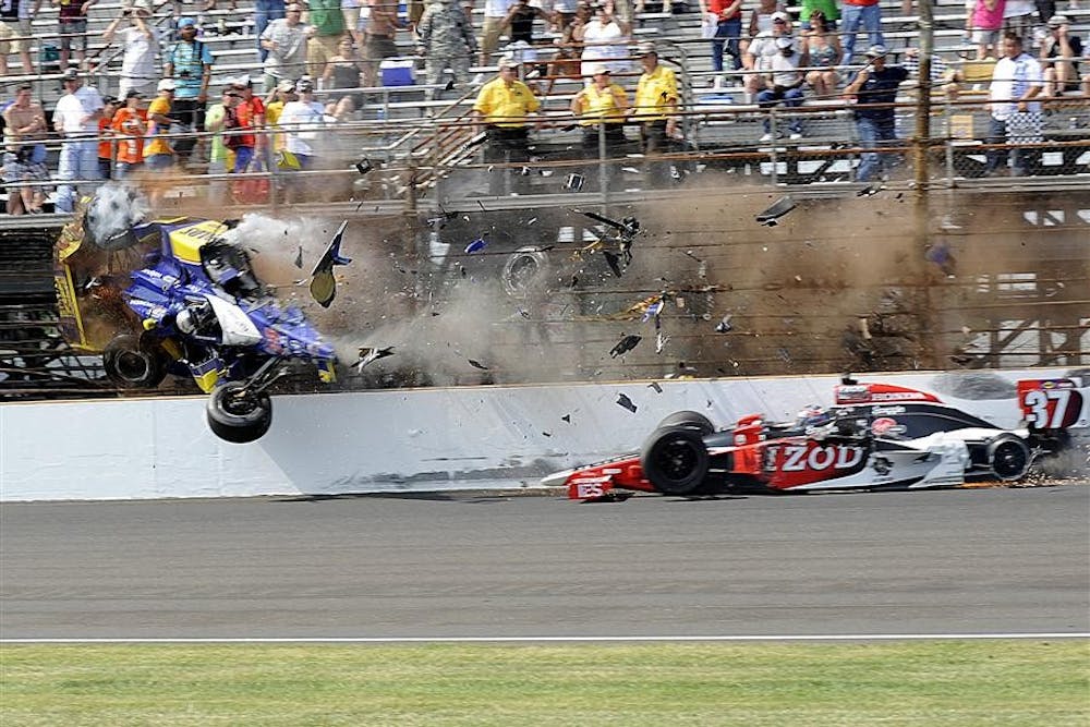 Mike Conway, of England, shatters his car on the safer barrier while Ryan Hunter-Reay, of Florida, spins out during the last laps of the Indianapolis 500 in Indianapolis, IN Sunday, May 30, 2010.