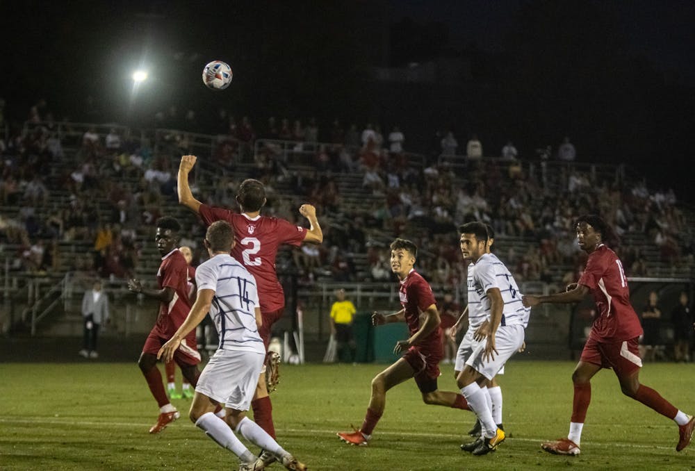 <p>Sophomore Joey Maher goes up for a ball from a free kick against Butler on Aug. 31, 2021, at Bill Armstrong Stadium. Sophomore defender Joey Maher scored the lone goal off of a rebound shot to give IU a 1-0 victory over Butler.</p>