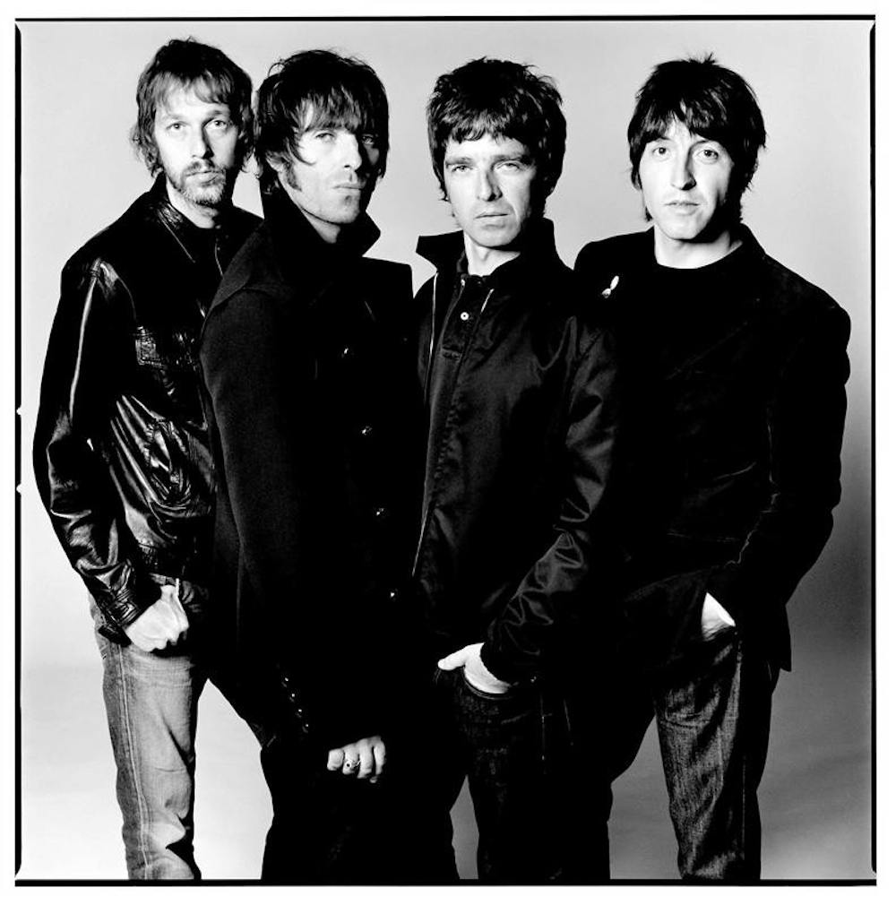 Oasis: The Beatles, except less attractive, more obnoxious, all in black and with more hair gel.