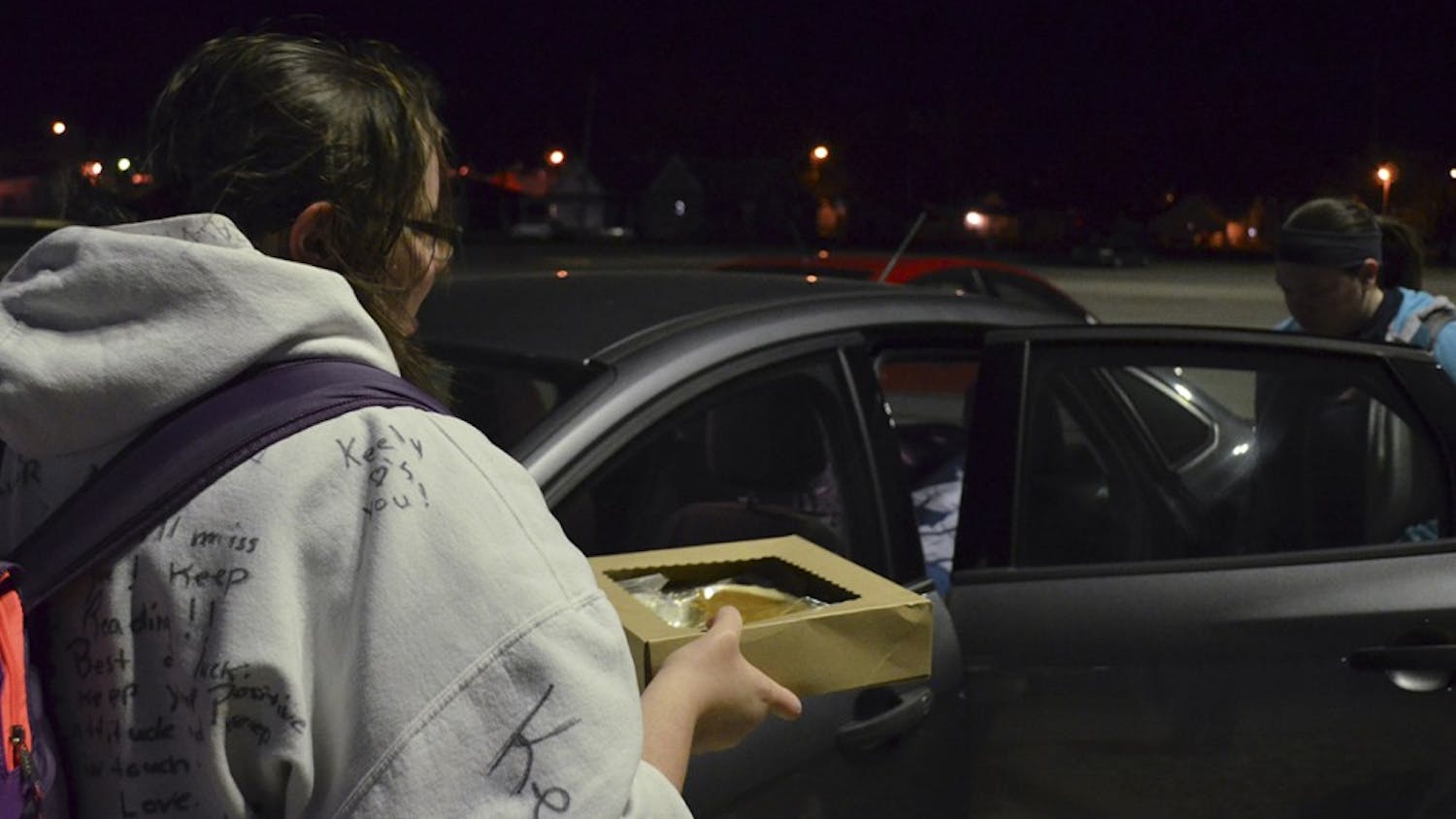 Nicole Allen packs a portion of her belongings into her roommate's car before leaving for Thanksgiving Break. One item she's bringing is a homemade pumpkin pie given to her for her birthday.