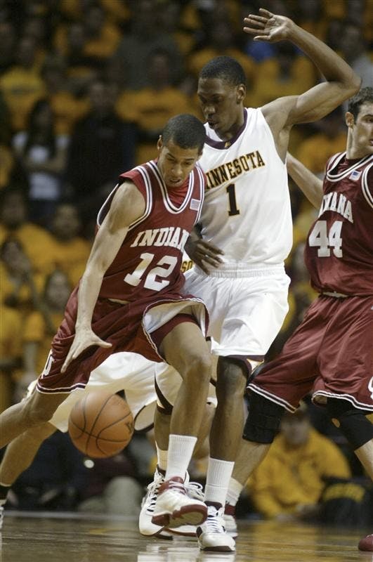 Indiana guard Verdell Jones III (12) drives against Minnesota forward Paul Carter (1) during the second half Tuesday in Minnesota. Jones had a team-high 18 points as Minnesota won 62-54.
