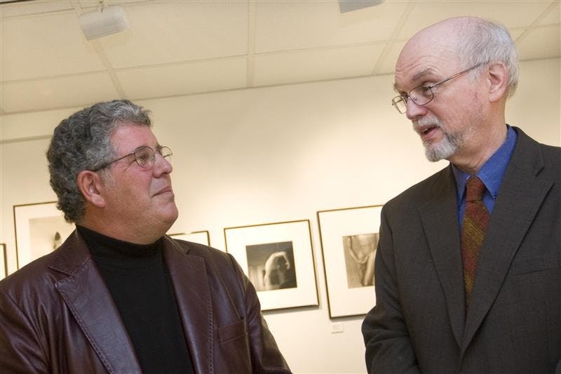 Exhibiting photographer Herbert Ascherman, Jr. and School of Journalism Professor Claude Cookman talk at the opening reception of Mr. Ascherman's exhibit on Sept. 12 at the Kinsey Institute. 