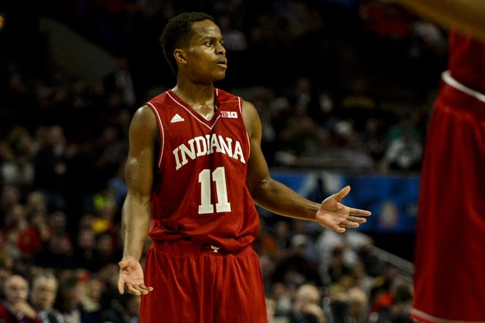 Junior guard Kevin "Yogi" Ferrell looks to head coach Tom Crean during a free throw Friday at the United Center in Chicago, Ill. IU lost to Maryland 75-69 in the third round of the Big Ten Tournament.