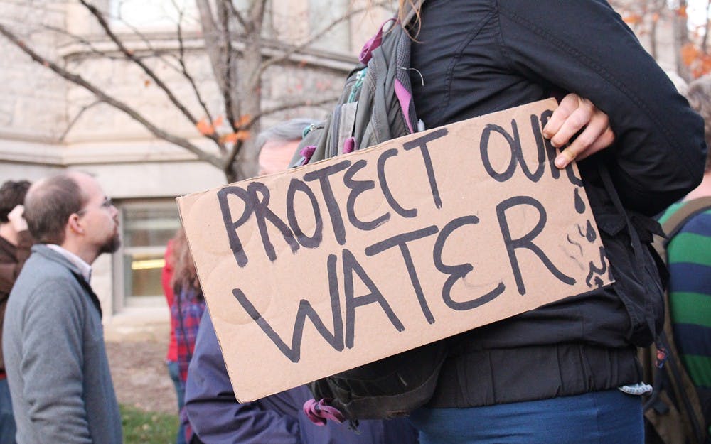 Protesters gathered at Sample Gates Tuesday evening to protest the Dakota Access Pipeline (DAPL). Native Americans, including several Sioux tribal nations, have spoken out against the DAPL, citing its potential environmental harm. 