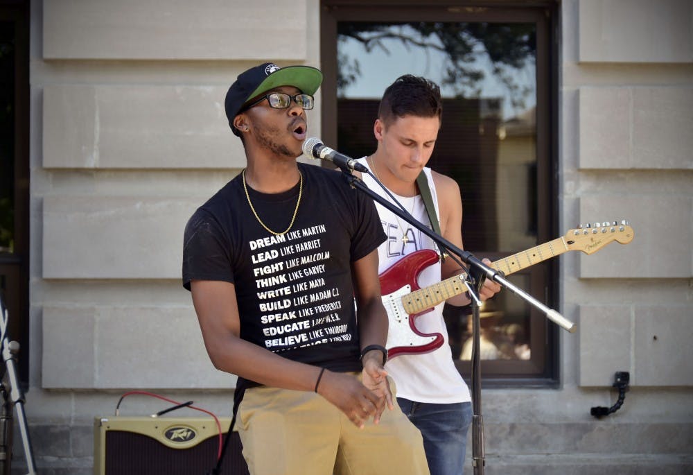Chris Redding Jr (front) and Mike Gronsky (back) sings for the Black Lives Matter Protest. 