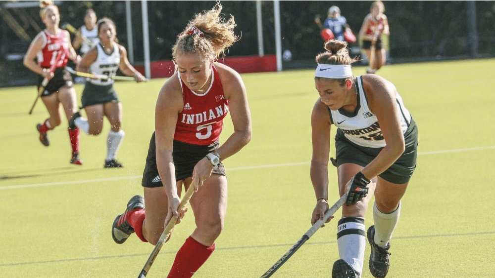 Then-freshman forward Hailey Couch keeps the ball away from Michigan State back Baily Higgins on Oct. 5, 2018, at the IU Field Hockey Complex. IU defeated Central Michigan University and Davidson University to start the season 2-0.