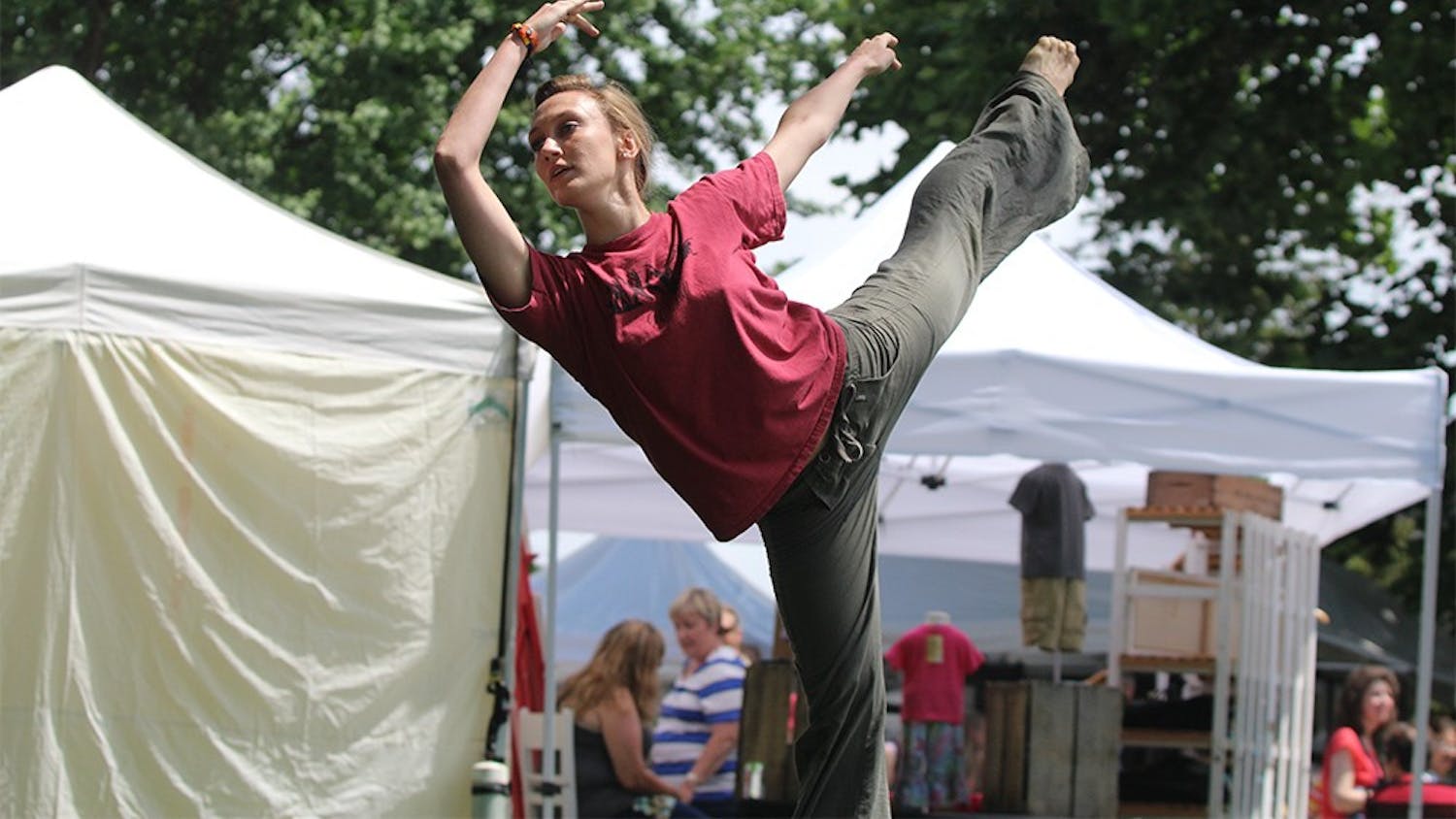 Jennifer Drettman, a Jacob's School graduate, dances with Windfall Dancers Inc. at the Arts Fair on the Square on Saturday. The fair offered a variety of art including performance, sculptures, and paintings.  