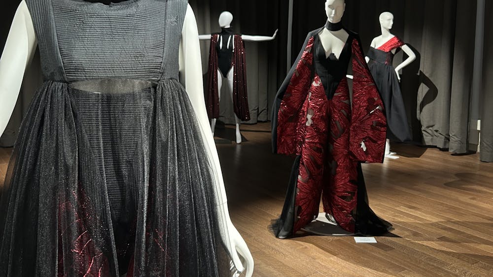 The exhibition’s designs are displayed on mannequins Sept. 22, 2023, at the Gayle Karch Cook Center in Maxwell Hall. The garments highlight women’s power, authority and femininity. 