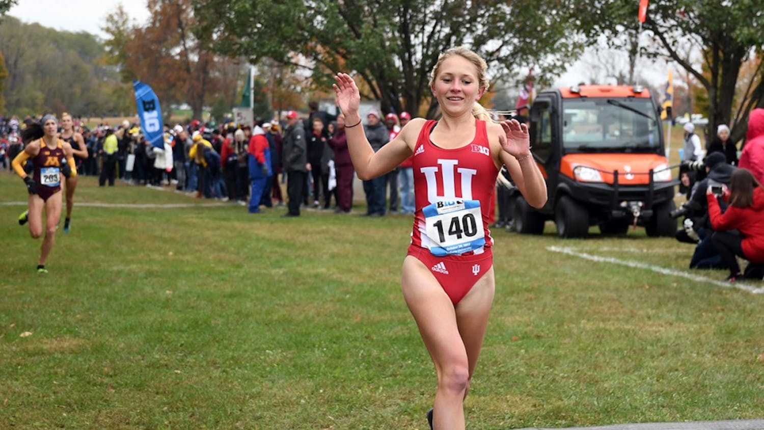 Junior Katherine Receveur celebrates as she crosses the finish line at the Big Ten Cross-Country Championship on Oct. 29 at the IU Championship Cross Country Course. IU will compete in the Big Ten Cross-Country Championship this weekend in Nebraska. 
