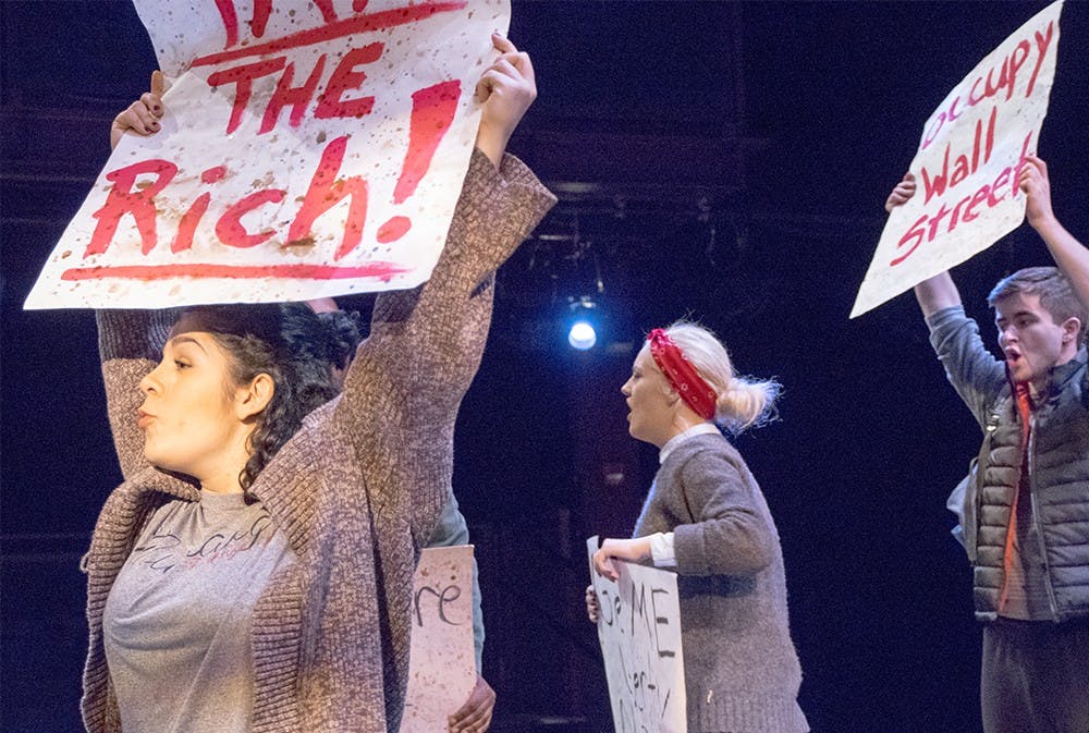 Rebecca Dwoskin, left,  practices during a rehearsal of At First Sight Monday evening at the Wells-Metz Theatre. At Frist Night is a play about Peruvia-American and the Occupy movement, directed by M.F.A candidates David Koté and Katie Horwitz. The show will open on Friday. 