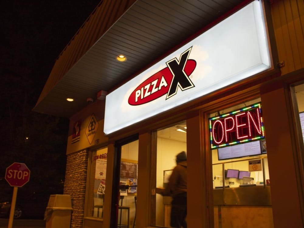 Pizza X Campus is located at 1791 E. 10th St. According to a facebook post made by the co-owner of Pizza X, Jeff Mease, hourly employees will receive a 75% pay raise as of April 8 until the end of June. 