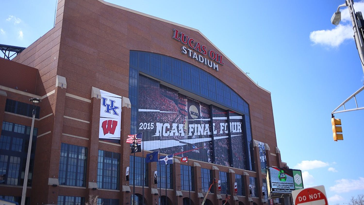 Final Four signs, along with participating team logos, adorn the exterior of Lucas Oil Stadium. 