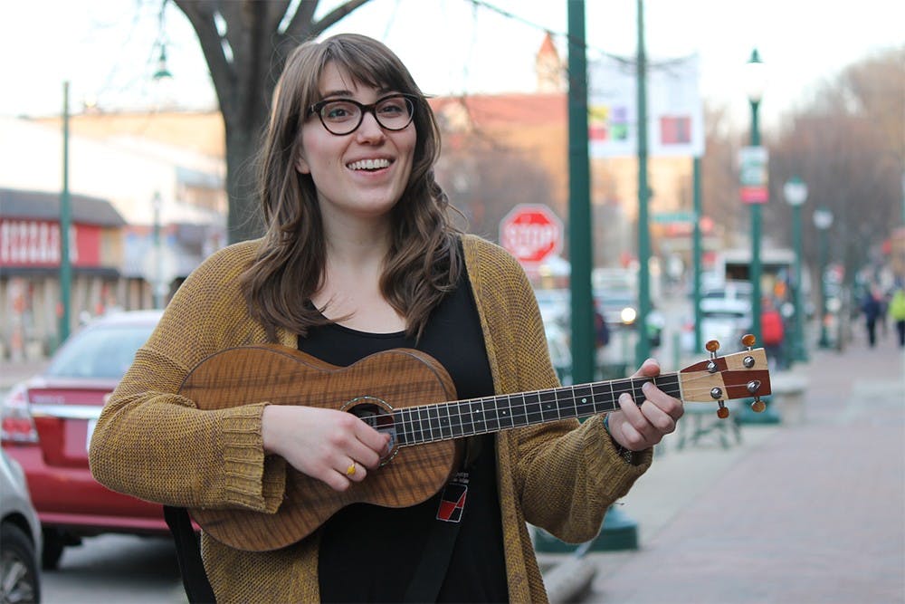 Singer/songwriter Danielle Anderson, known by her YouTube name of Danielle Ate the Sandwich, sings and plays the ukelele on Kirkwood Ave. on Friday. Anderson performed at the Pourhouse Cafe Friday evening. 