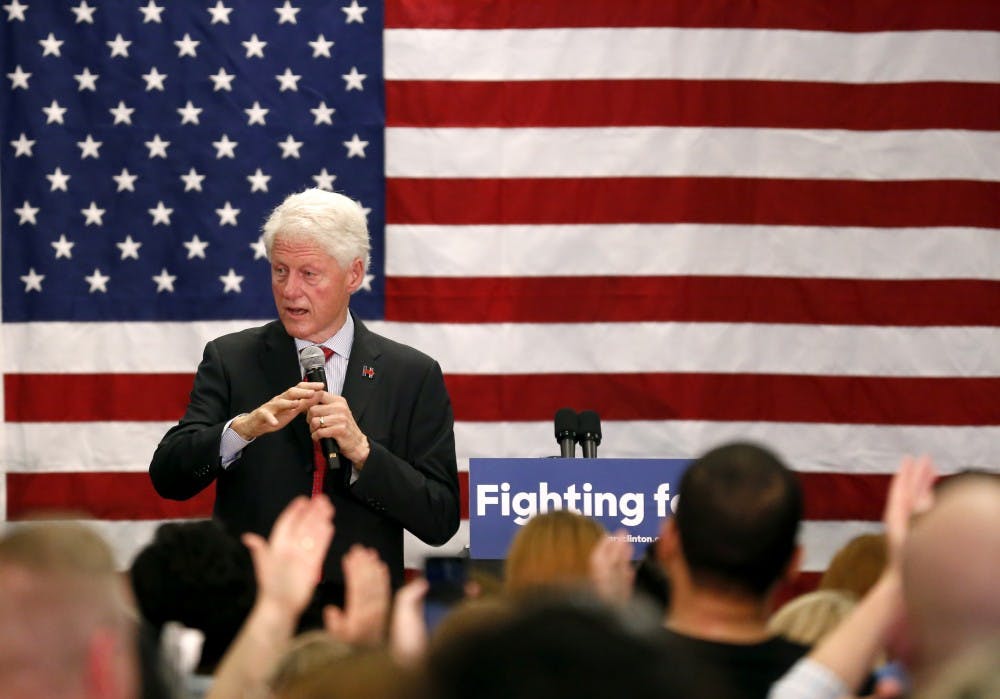 President Bill Clinton talks with crowd after finishing the speech Tuesday at Hillary Clinton's campaign office in Indianapolis. Bill addressed immigration, healthcare, Wall Street and college tuition. 