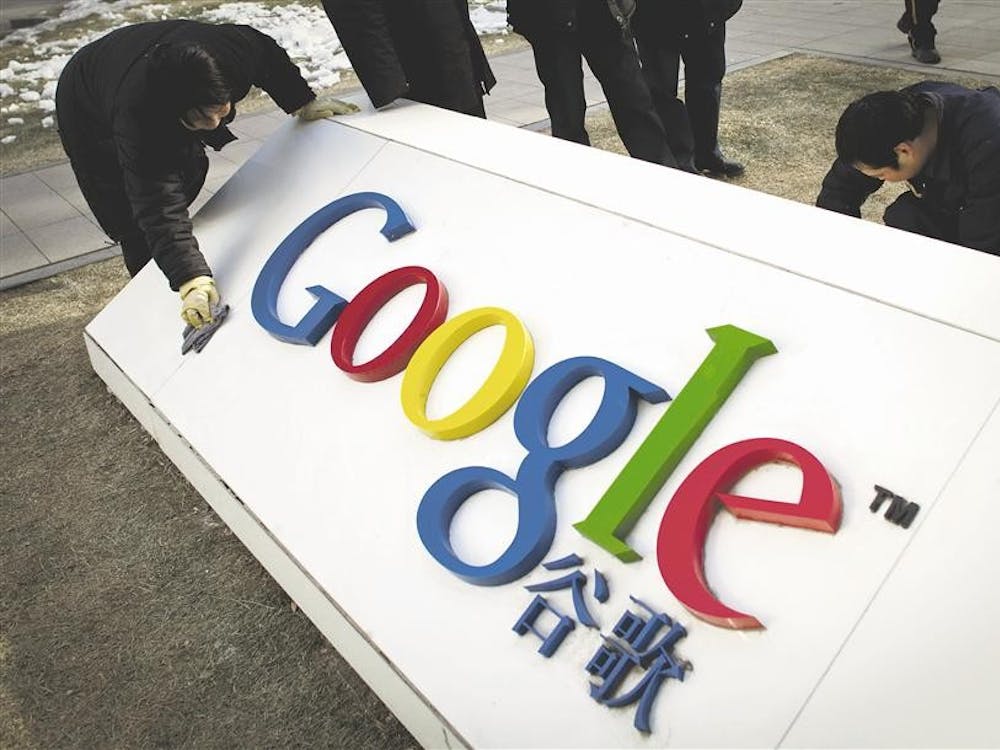 Workers clean and repair broken parts of a marble tablet bearing Google's logo in front of Google China's headquarters building in Beijing on Jan. 25. Google's future in China is in limbo and observers around the world are carefully tracking its dispute with Beijing. But one group is notably lukewarm on the fate of the Internet giant in the world's most populous online market: many of China's 384 million Internet users.