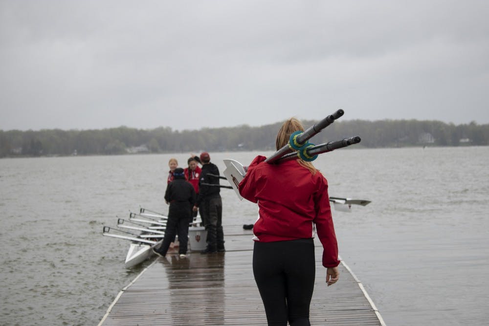 <p>Rowers prepare their boats April 20 at Dale England Rowing Center on Lake Lemon. IU won with 72 points in the 11th annual Dale England Cup against the University of Notre Dame and Michigan State. </p>