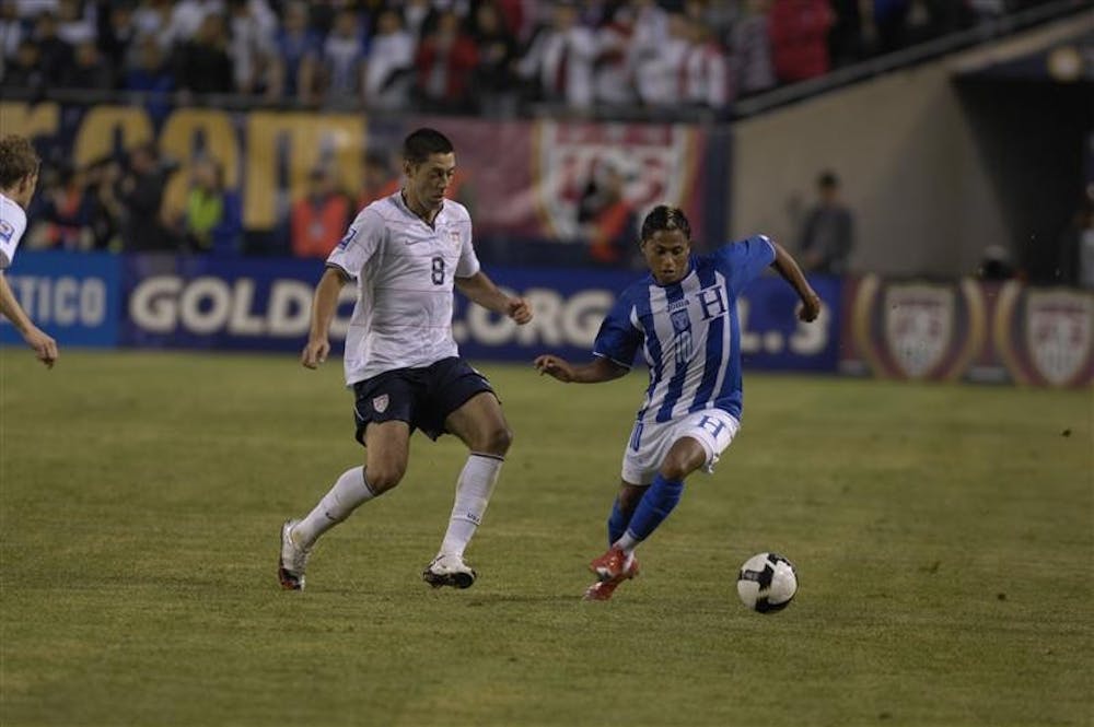 Clint Dempsey of the US Men's National Team and Ramon Nunez of Honduras battle for the ball during Saturday night's contest at Soldier Field in Chicago.