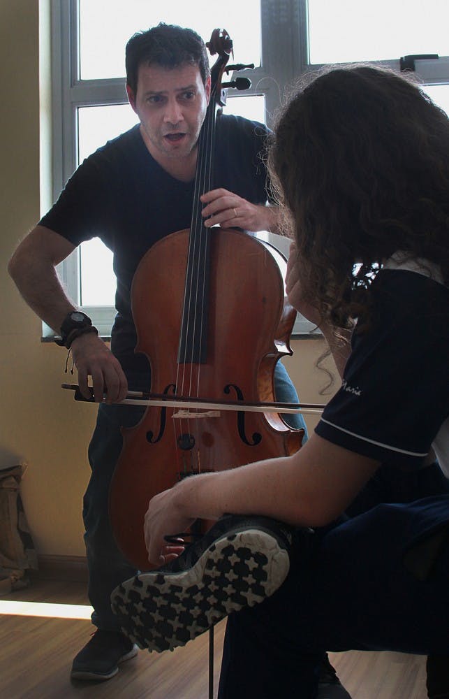 André Micheletti, a Jacobs School of Music alumnus, instructs Luiz Fernando during a private lesson on November 10, 2014. At age 14 Fernando was the youngest Brazilian to perform at Carnegie Hall.