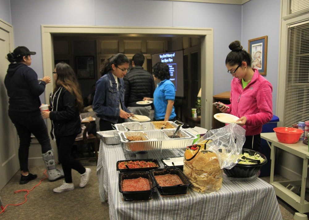 Students create their own tacos as an interactive and delicious part of the Latino Cultural Night event. The event was held at La Casa Latino Cultural Center on Tuesday.