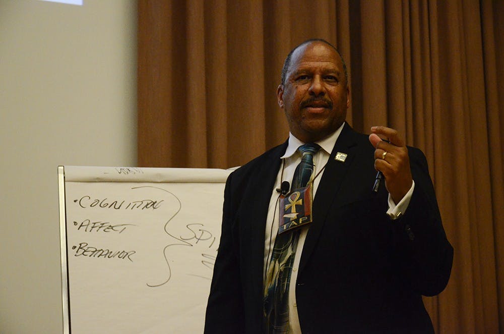 Thomas A. Parham, Ph.D., Vice Chancellor for Student Affairs at University of California, Irvine, gives a lecture titled "Historical Trauma & Mental Health in the African American Community" in the Grand Hall at the Neal Marshall Black Culture Center on Wednesday. 