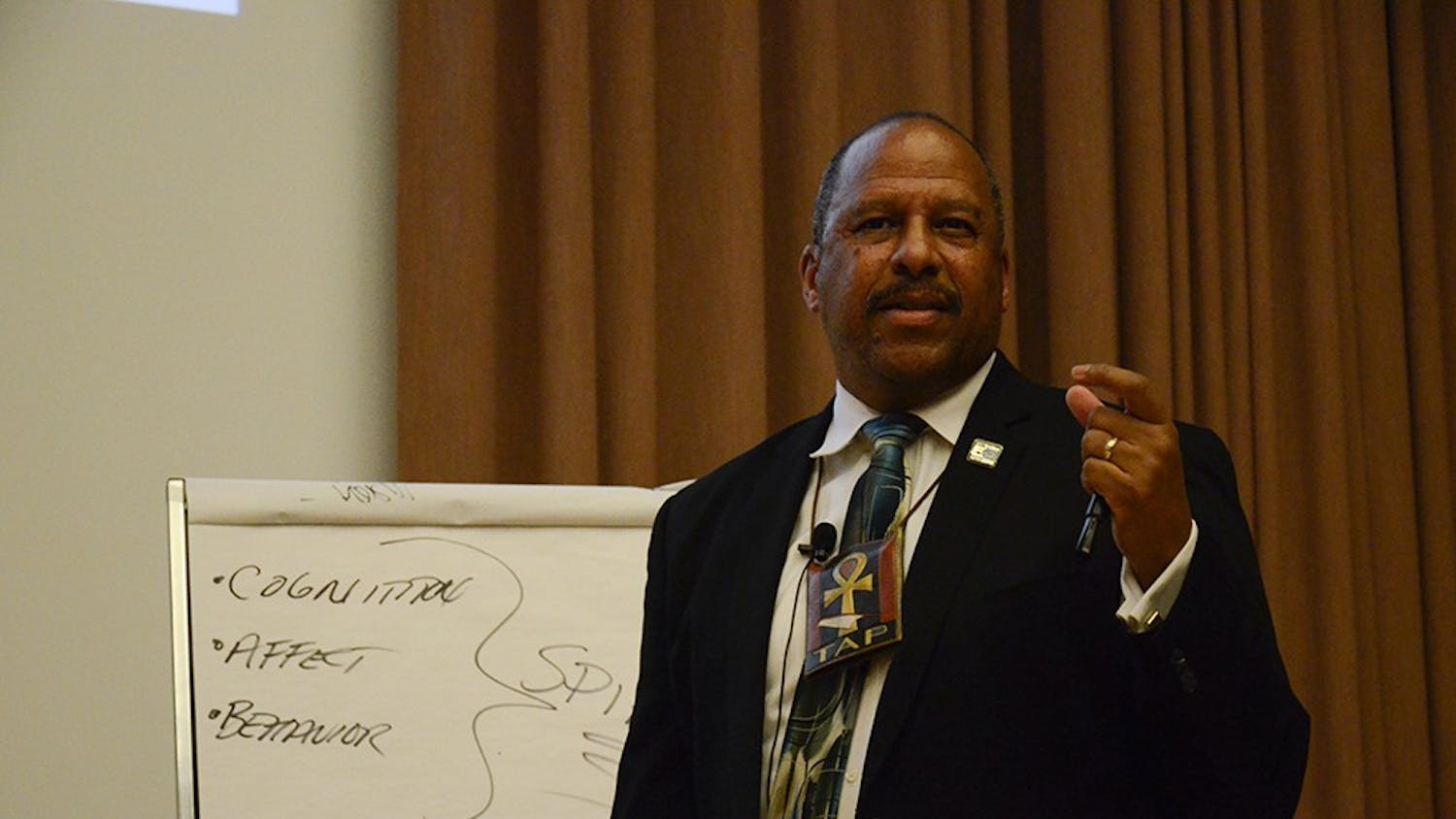 Thomas A. Parham, Ph.D., Vice Chancellor for Student Affairs at University of California, Irvine, gives a lecture titled "Historical Trauma & Mental Health in the African American Community" in the Grand Hall at the Neal Marshall Black Culture Center on Wednesday.