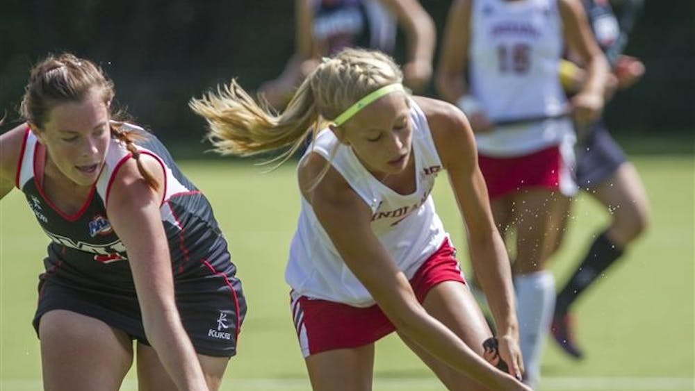 Junior Corinne Karch tries to keep the ball from going out of bounds during IU's match against Robert Morris on Sunday at the IU Field Hockey Complex.