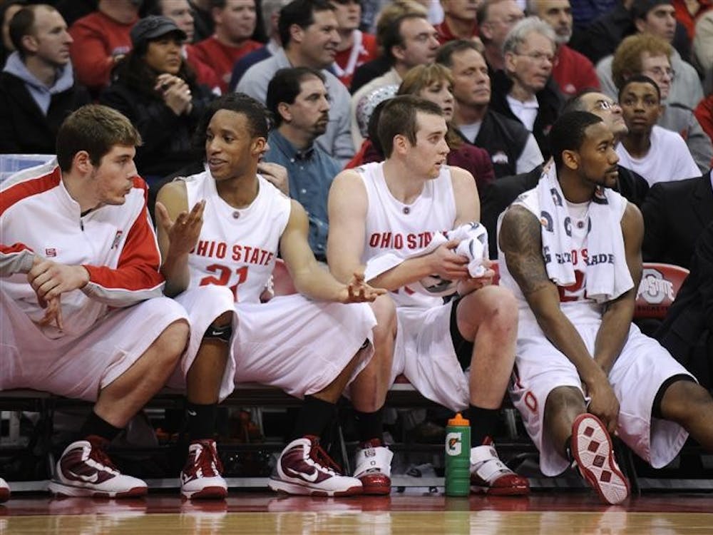 The Ohio State bench, including Evan Turner (21) relaxes comfortably as the Buckeyes pull away from IU by more than 20 points in the first half of a game on Wednesday, Jan. 6, 2010, in Columbus, Ohio.