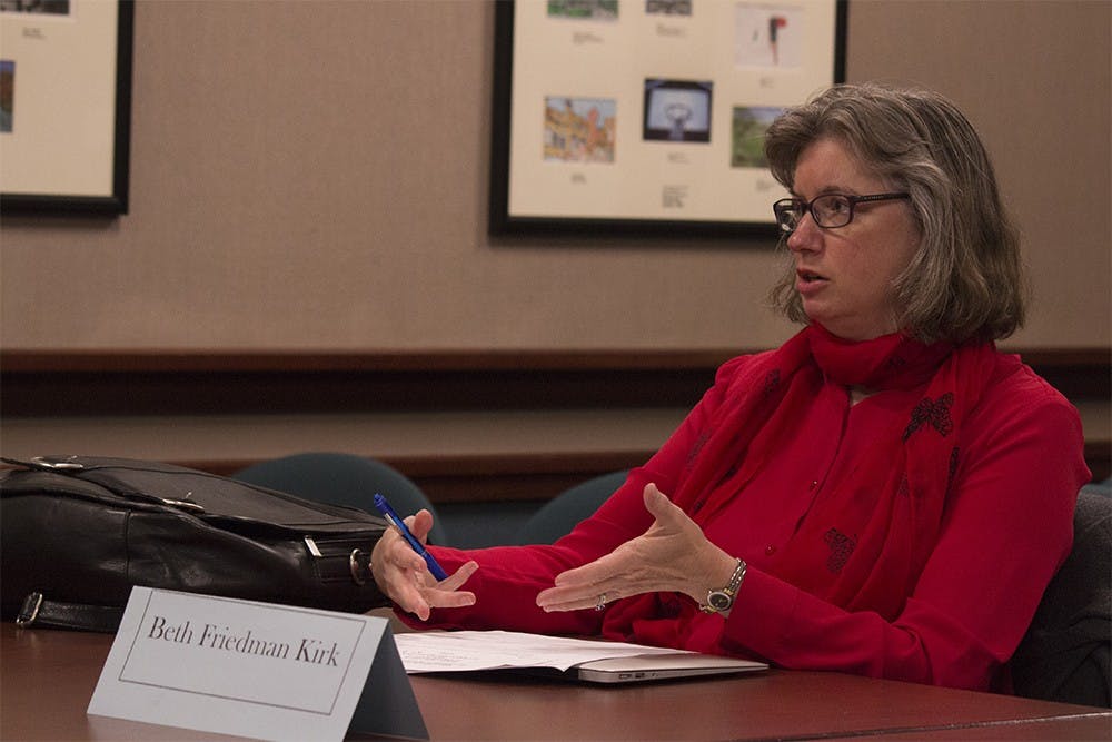 Beth Friedman Kirk, a member of the Bloomington Commission on the Status of Women, speaks about the annual Woman's History Month Luncheon during a meeting on Thursday night at City Hall. 