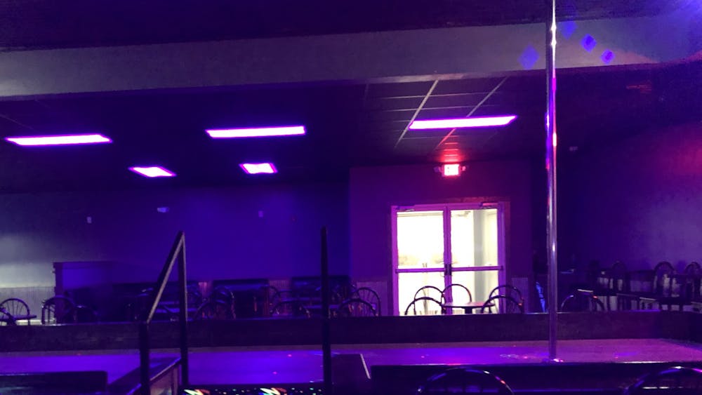 The stage at Night Moves strip club sits Jan. 23. The club reopened Thursday after the city bought its old building as part of the plan to build Switchyard Park.