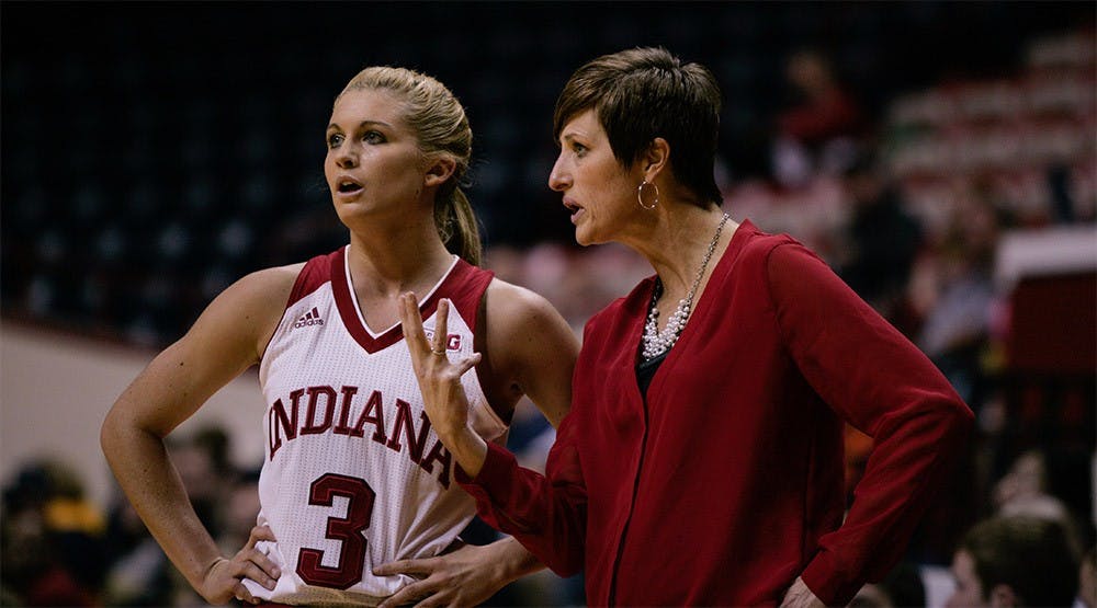 Sophomore guard Tyra Buss and head coach Teri Moren talk strategy during a stopage in play against Gerogia Tech Dec. 2. IU beat Georgia Tech 69-60. 