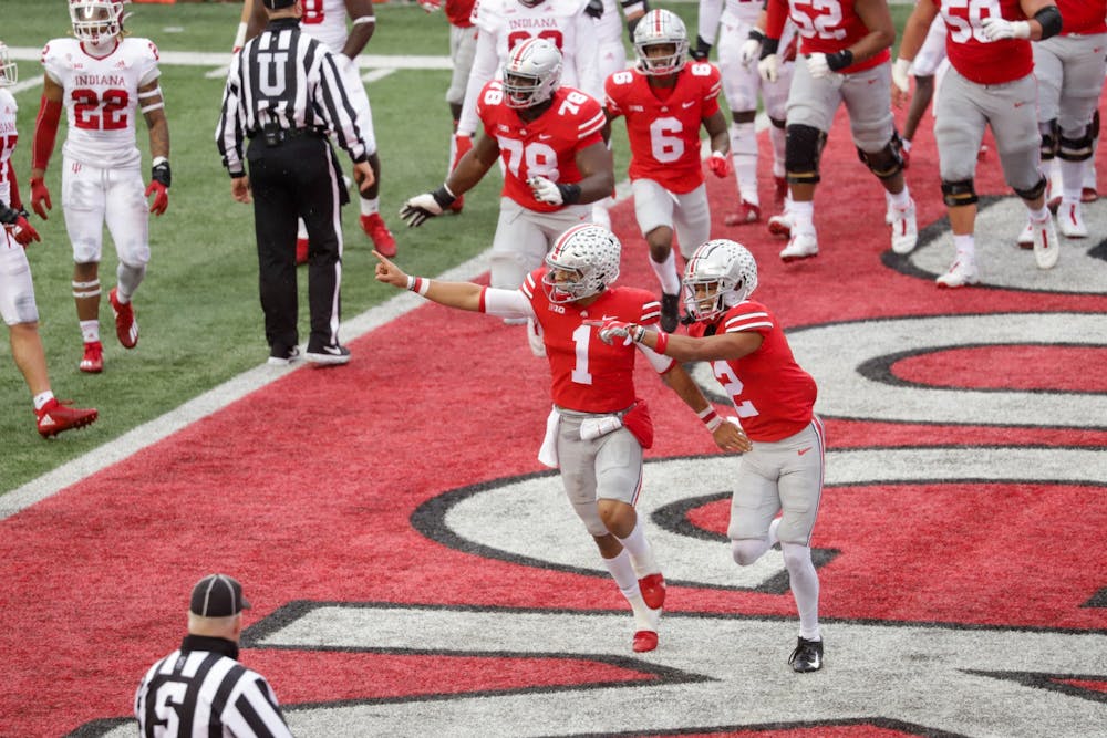 <p>Ohio State quarterback Justin Fields celebrates after scoring a touchdown Nov. 21 against IU in Columbus, Ohio. No. 9 IU&#x27;s comeback came just short Saturday, giving No. 3 Ohio State a 42-35 win.</p>