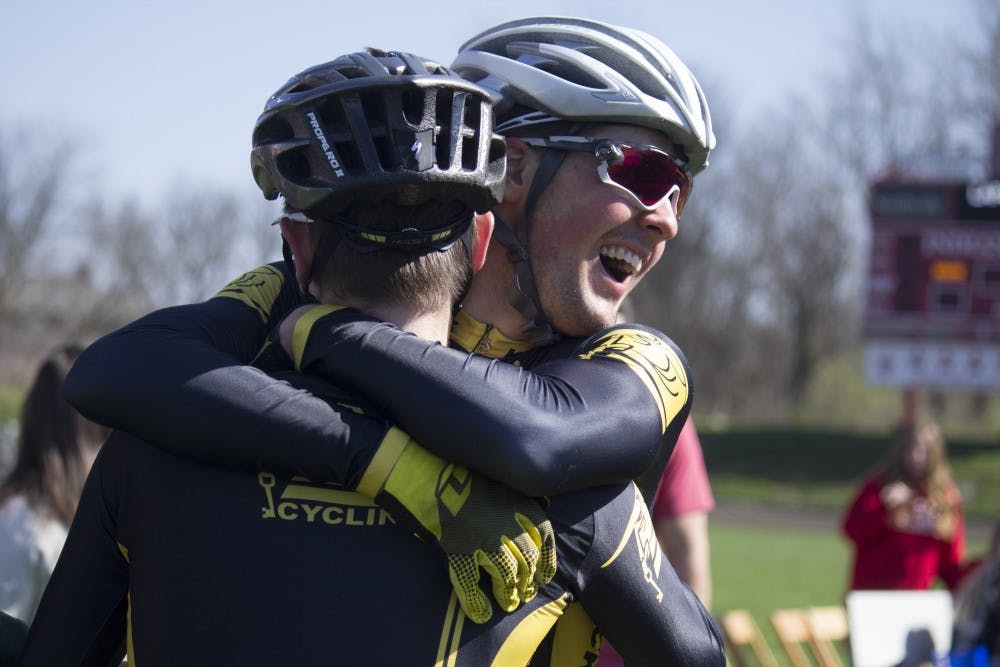 Black Key Bulls rider Charlie Hammon embraces a teammate after their qualifying attempt on Saturday at Bill Armstrong Stadium. BKB will start the Little 500 race from the third place position.