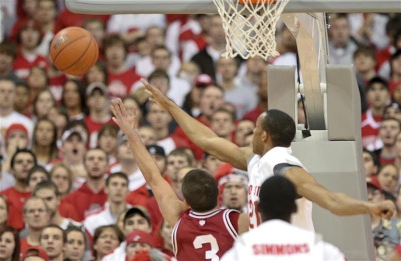IU freshman guard Daniel Moore and Ohio State Guard/Forward Evan Turner reach for the ball Tuesday evening on the road in Ohio State. The Hoosiers lost 77-53. The Hoosiers face Penn State Saturday at Assembly Hall.
