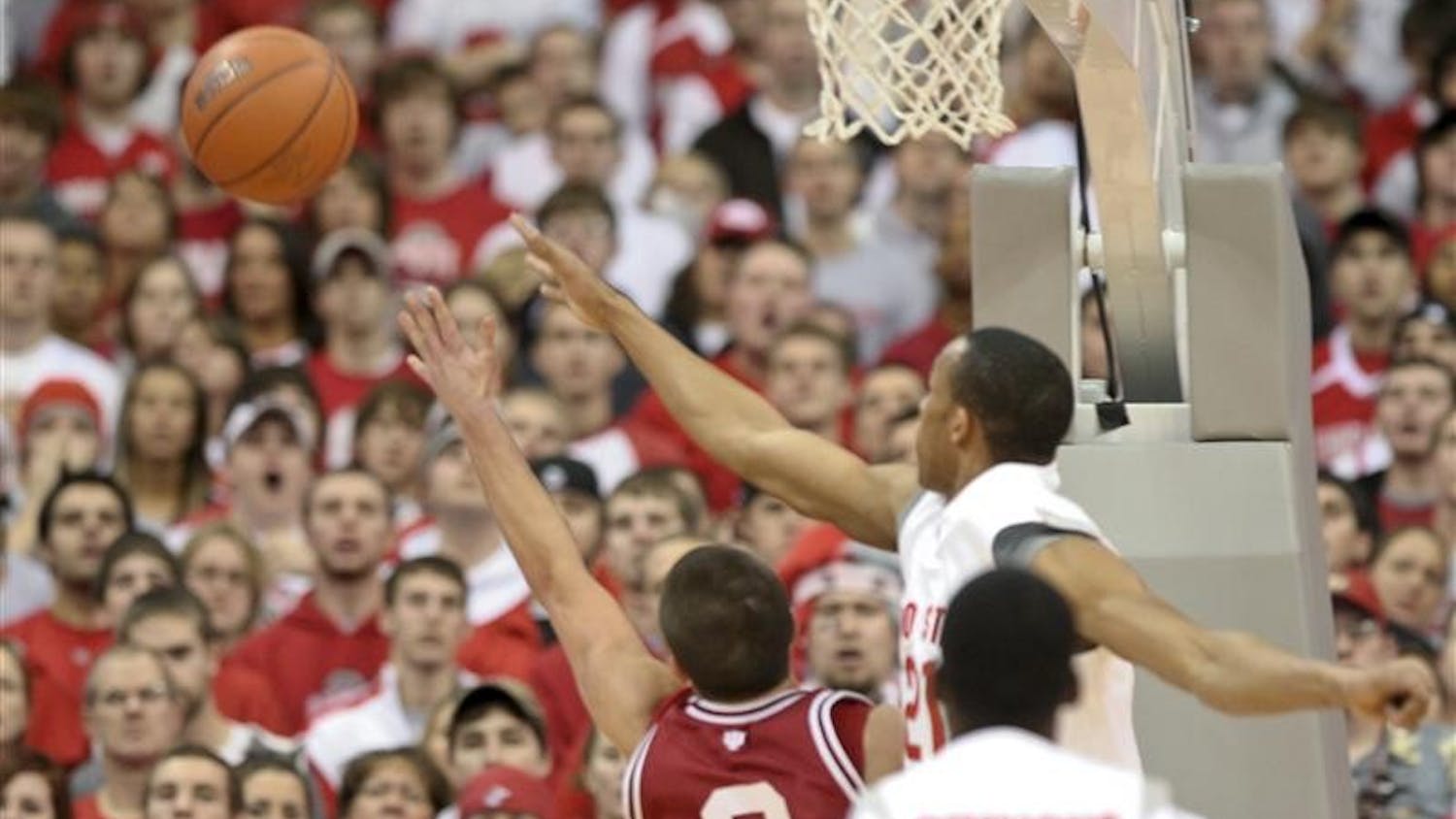 IU freshman guard Daniel Moore and Ohio State Guard/Forward Evan Turner reach for the ball Tuesday evening on the road in Ohio State. The Hoosiers lost 77-53. The Hoosiers face Penn State Saturday at Assembly Hall.